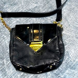 Bebe black and gold purse
